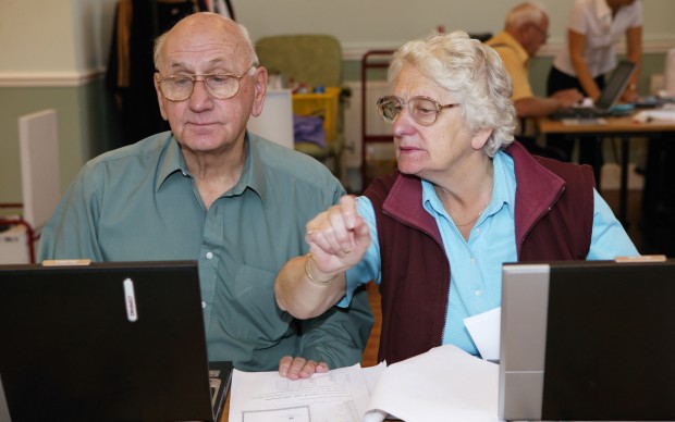 Man and woman at an over 60s computer training class