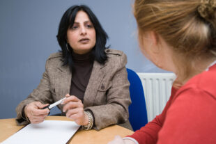 Two women in an interview situation. 