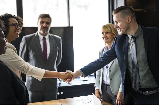 Man and woman shaking hands