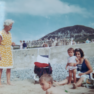 Family photo on the beach from when Petra was a baby. 