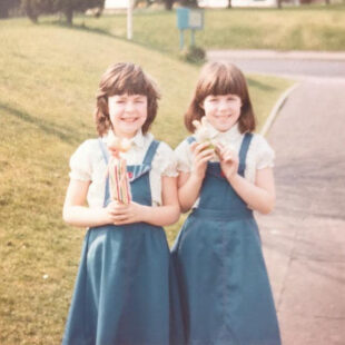 Nina (left) and Zoe (right) as children holding toys