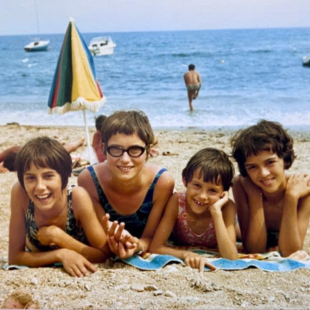 Shirley and her three sisters at the beach when they were children