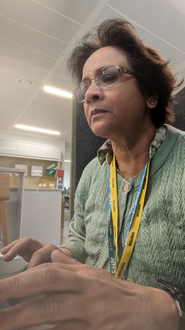 Sree typing on a laptop 